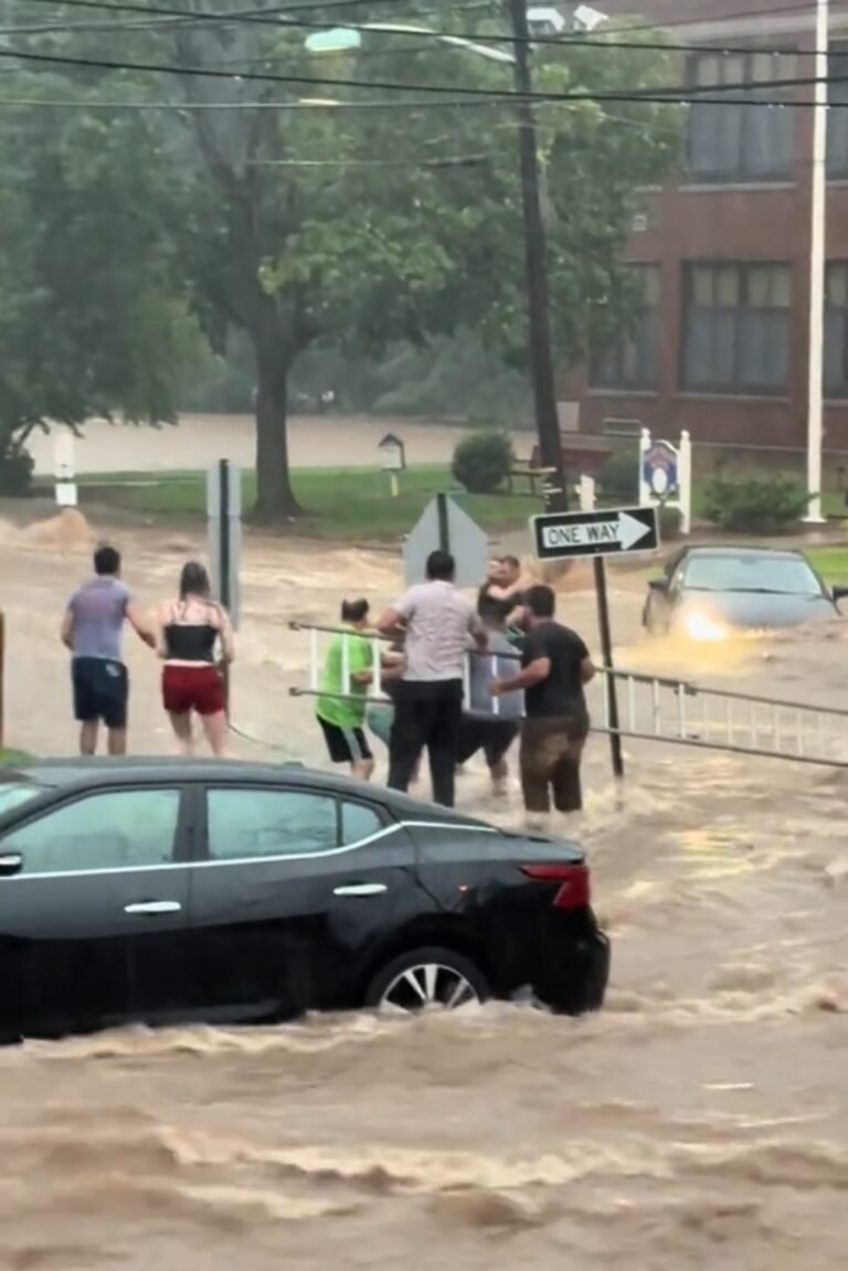 Cars submerged on a flooded New York City street after a July 2025 storm