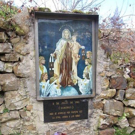 Stone shrine with painting of Our Lady of Mount Carmel and children