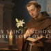 Saint Anthony of Padua in prayer with a gentle expression, wearing a brown Franciscan habit in a candlelit church setting